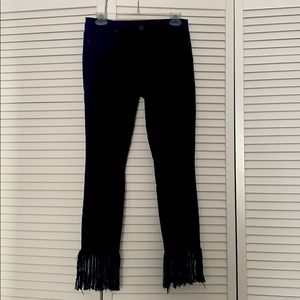 Black jeans with fringe bottoms